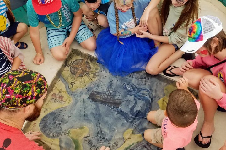 a group of people sitting on a bed